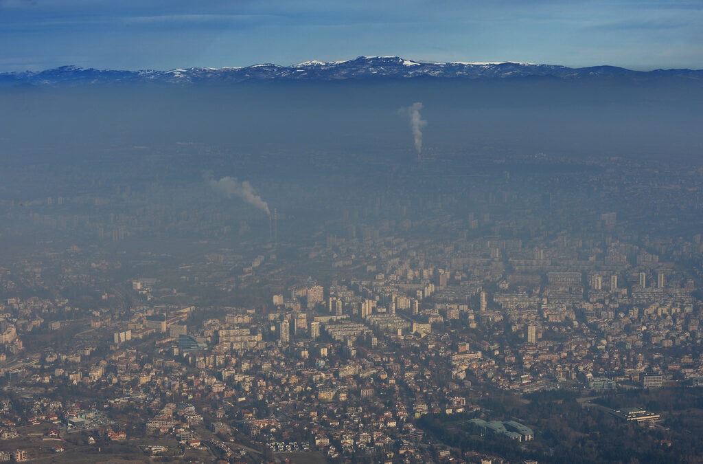 Air pollution over a city with heavy smog and industrial emissions